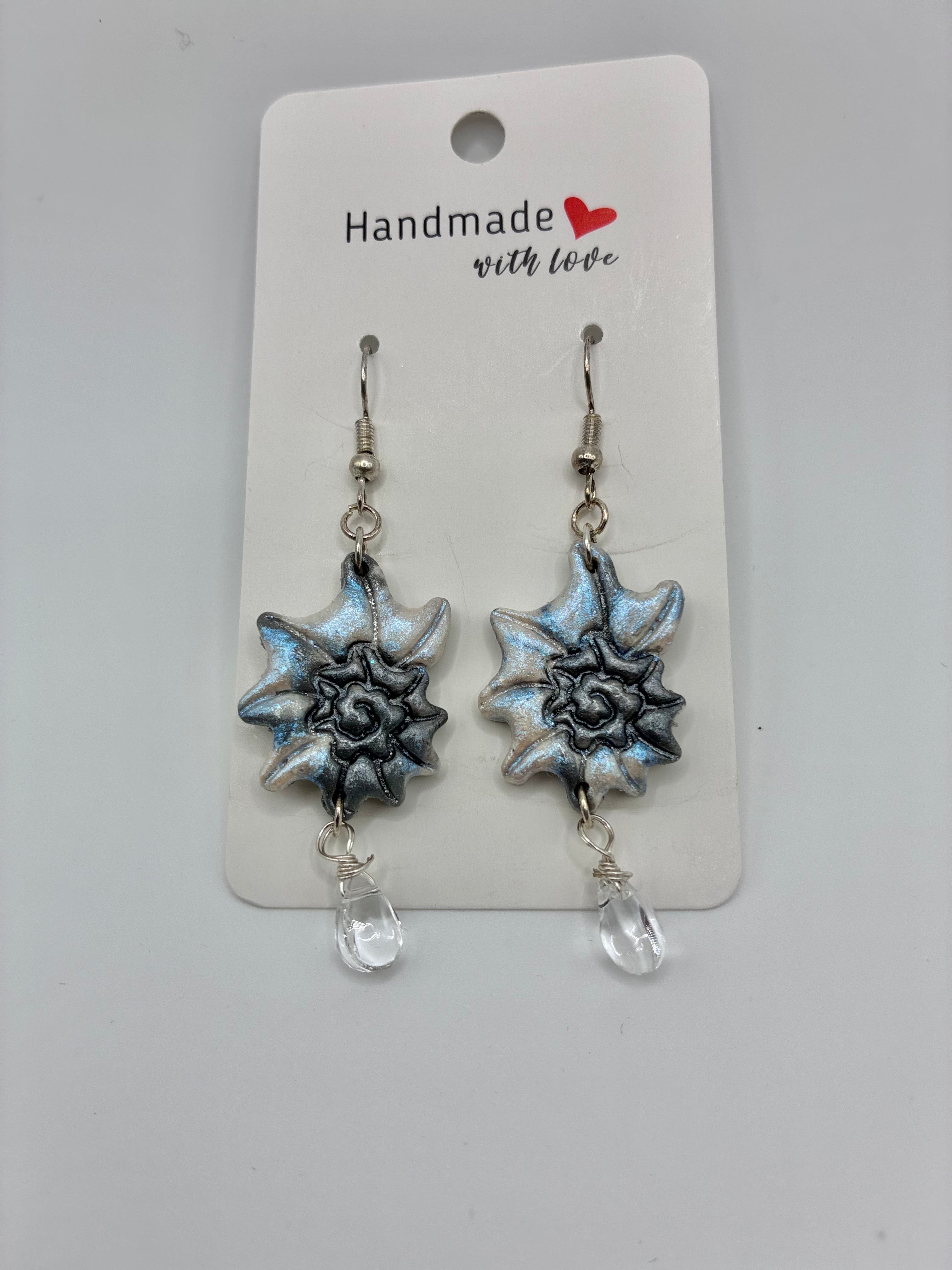 Pair of silver star-shaped earrings with clear beads on a 'Handmade with Love' card.